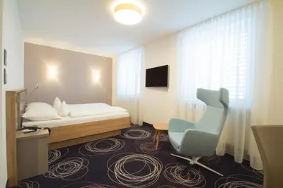 Ein Bett oder Betten in einem Zimmer der Unterkunft Hotel Rio Karlsruhe