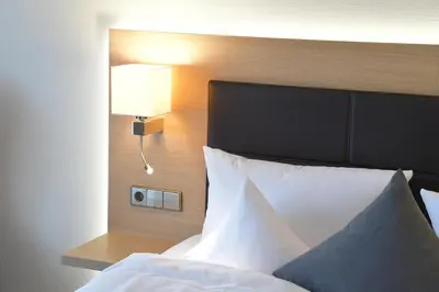 Ein Bett oder Betten in einem Zimmer der Unterkunft Hotel Krone