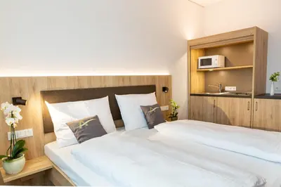 Ein Bett oder Betten in einem Zimmer der Unterkunft Aparthotel Am Pfaffenstein