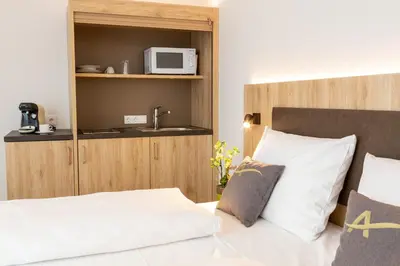 Ein Bett oder Betten in einem Zimmer der Unterkunft Aparthotel Am Pfaffenstein