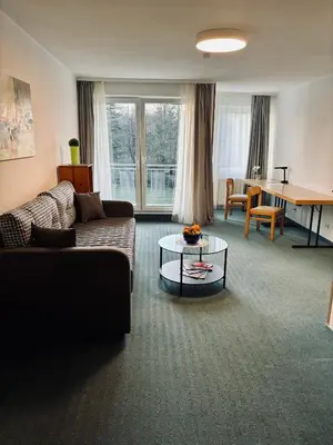 Ein Sitzbereich in der Unterkunft Hotel Bessunger Forst