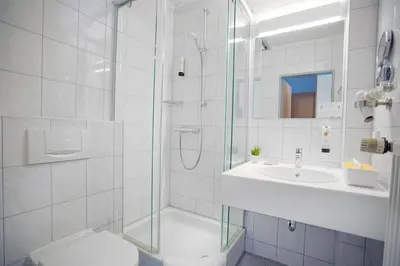 Ein Badezimmer in der Unterkunft Hotel Bessunger Forst
