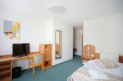 Ein Bett oder Betten in einem Zimmer der Unterkunft Hotel Bessunger Forst