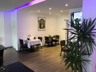 Ein Restaurant oder anderes Speiselokal in der Unterkunft Wincent Hotel GmbH