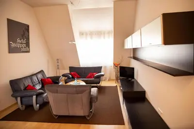 Ein Sitzbereich in der Unterkunft Ferienwohnung Wappenstube