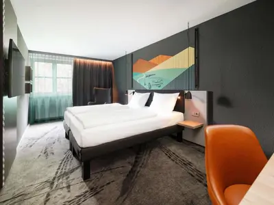 Ein Bett oder Betten in einem Zimmer der Unterkunft ibis Styles Neckarsulm