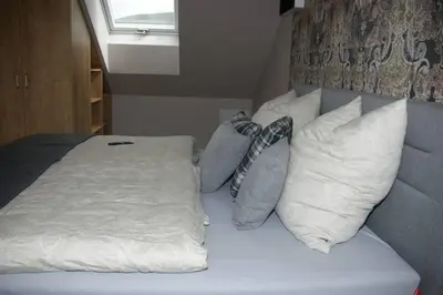 Ein Bett oder Betten in einem Zimmer der Unterkunft Ferienwohnung 'Burgblick'