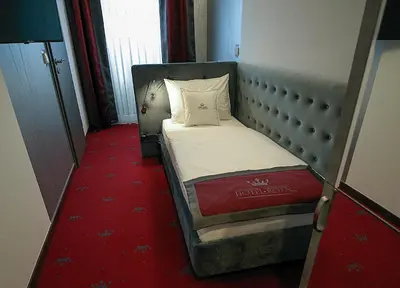Ein Bett oder Betten in einem Zimmer der Unterkunft Hotel Royal