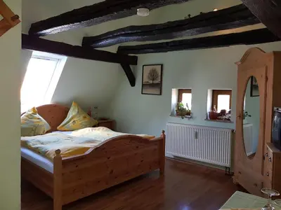 Ein Bett oder Betten in einem Zimmer der Unterkunft Zum Burgtörle