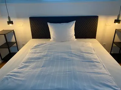 Ein Bett oder Betten in einem Zimmer der Unterkunft City Apartments Kaiserslautern
