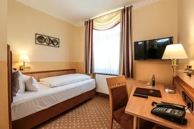 Ein Bett oder Betten in einem Zimmer der Unterkunft Hotel Mack Private Inn