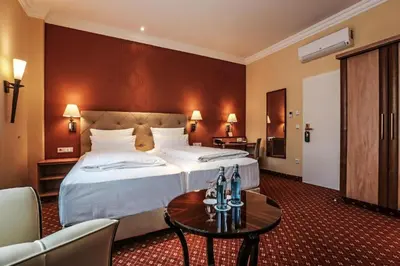 Ein Bett oder Betten in einem Zimmer der Unterkunft Hotel Mack Private Inn