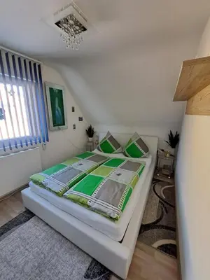 Ein Bett oder Betten in einem Zimmer der Unterkunft Ferienwohnung galina