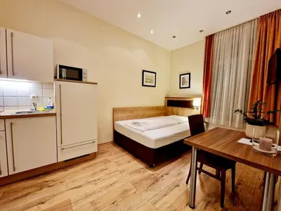 Ein Bett oder Betten in einem Zimmer der Unterkunft Hofgarten Apartments