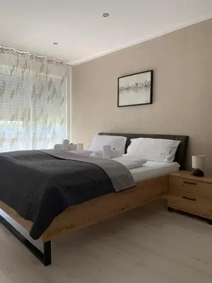Ein Bett oder Betten in einem Zimmer der Unterkunft HGH - Hotel Garni Helbig