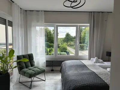 Ein Bett oder Betten in einem Zimmer der Unterkunft HGH - Hotel Garni Helbig