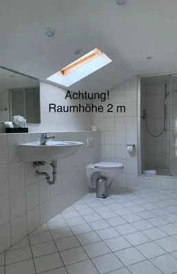 Ein Badezimmer in der Unterkunft HGH - Hotel Garni Helbig