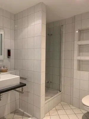 Ein Badezimmer in der Unterkunft HGH - Hotel Garni Helbig