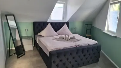 Ein Bett oder Betten in einem Zimmer der Unterkunft FeWo 2 - Deidesheim