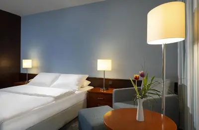 Ein Bett oder Betten in einem Zimmer der Unterkunft Maritim Hotel Darmstadt