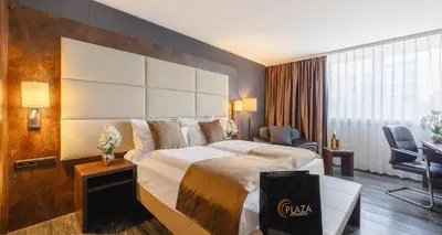 Ein Bett oder Betten in einem Zimmer der Unterkunft PLAZA Premium Darmstadt