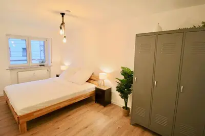 Ein Bett oder Betten in einem Zimmer der Unterkunft Fantastische Moderne und Zentrale Wohnung mit Balkon