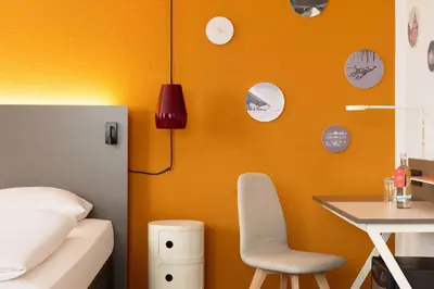 Ein Bett oder Betten in einem Zimmer der Unterkunft Vienna House Easy by Wyndham Neckarsulm