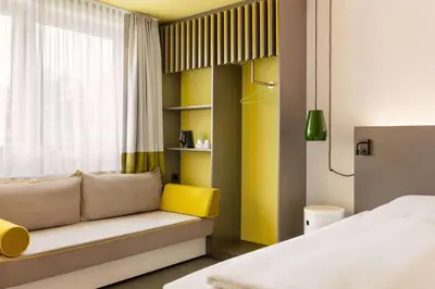 Ein Bett oder Betten in einem Zimmer der Unterkunft Vienna House Easy by Wyndham Neckarsulm