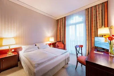 Ein Bett oder Betten in einem Zimmer der Unterkunft Parkhotel 1901 Mannheim