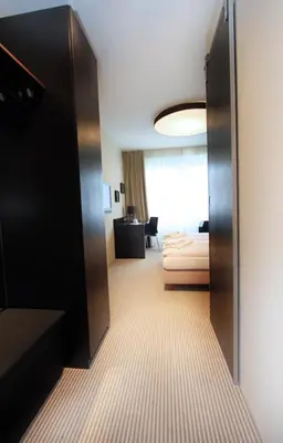 Ein Bett oder Betten in einem Zimmer der Unterkunft Karlstor Gästehaus