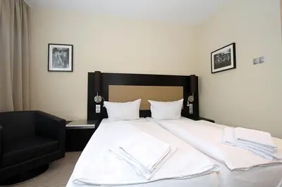 Ein Bett oder Betten in einem Zimmer der Unterkunft Karlstor Gästehaus