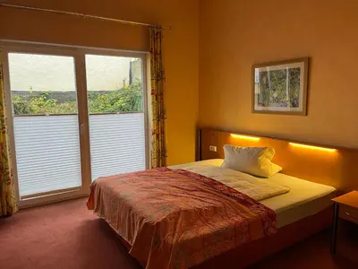 Ein Bett oder Betten in einem Zimmer der Unterkunft Landhotel Ritter-Post