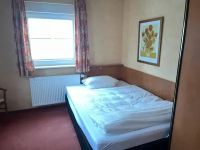 Ein Bett oder Betten in einem Zimmer der Unterkunft Landhotel Ritter-Post