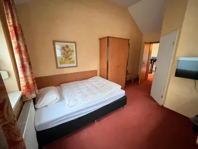 Ein Bett oder Betten in einem Zimmer der Unterkunft Landhotel Ritter-Post