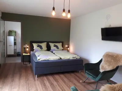 Ein Bett oder Betten in einem Zimmer der Unterkunft Weinlodge am Geissberg