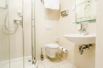 Ein Badezimmer in der Unterkunft Parkhotel Krone