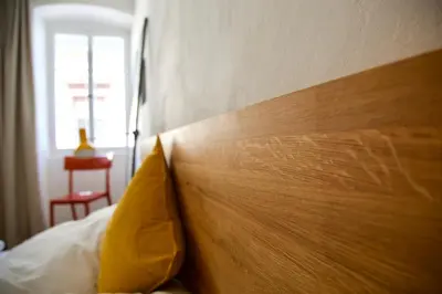 Ein Bett oder Betten in einem Zimmer der Unterkunft Boutique-Ferienwohnung im alten Weinhaus Moser