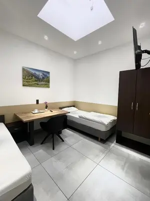 Ein Bett oder Betten in einem Zimmer der Unterkunft Stadtpension Heilbronn