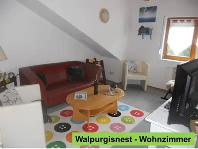 Ein Sitzbereich in der Unterkunft Waldnest Odenwald