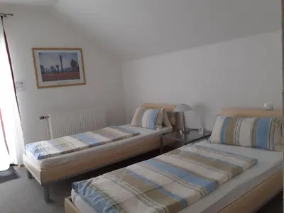 Ein Bett oder Betten in einem Zimmer der Unterkunft Ferienwohnung Rheinzabern