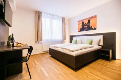 Ein Bett oder Betten in einem Zimmer der Unterkunft GuestHouse Speyer