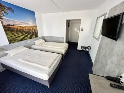 Ein Bett oder Betten in einem Zimmer der Unterkunft Asgard Hotel
