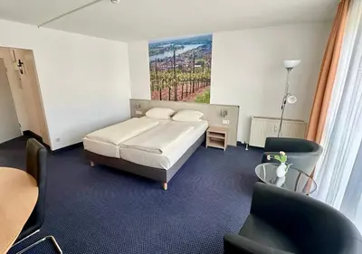 Ein Bett oder Betten in einem Zimmer der Unterkunft Asgard Hotel