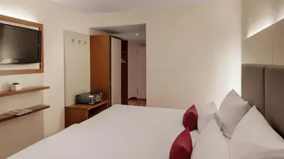 Ein Bett oder Betten in einem Zimmer der Unterkunft Hotel Newton Heilbronn