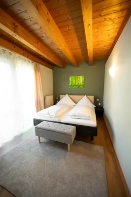 Ein Bett oder Betten in einem Zimmer der Unterkunft Adler Landhotel