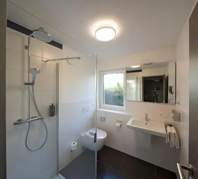 Ein Badezimmer in der Unterkunft ANA Living Karlsruhe, Trademark Collection by Wyndham