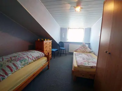 Ein Bett oder Betten in einem Zimmer der Unterkunft Ferienwohnung Olm