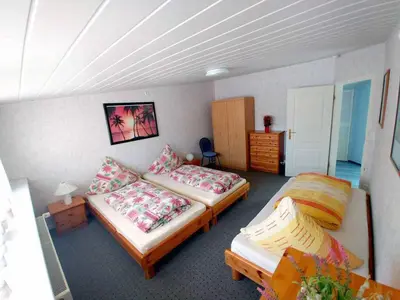 Ein Bett oder Betten in einem Zimmer der Unterkunft Ferienwohnung Olm