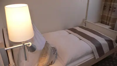 Ein Bett oder Betten in einem Zimmer der Unterkunft Hotel-Restaurant Arneggers Adler