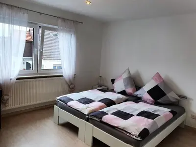 Ein Bett oder Betten in einem Zimmer der Unterkunft Pension Nickel Ferienwohnung II Waldstraße 18 Alsbach-Hähnlein